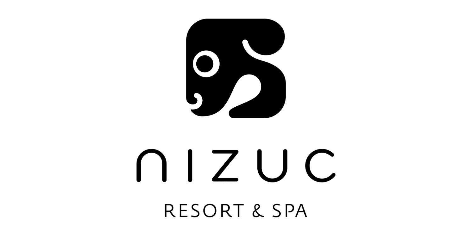 The Nizuc Resort & Spa logo in Mexico showcases a sleek black elephant head above the sophisticated text “nizuc” and “RESORT & SPA,” reflecting the luxury of their Ocean Suite. The Nizuc Resort & Spa logo in Mexico showcases a sleek black elephant head above the sophisticated text "nizuc" and "RESORT & SPA," reflecting the luxury of their Ocean Suite.