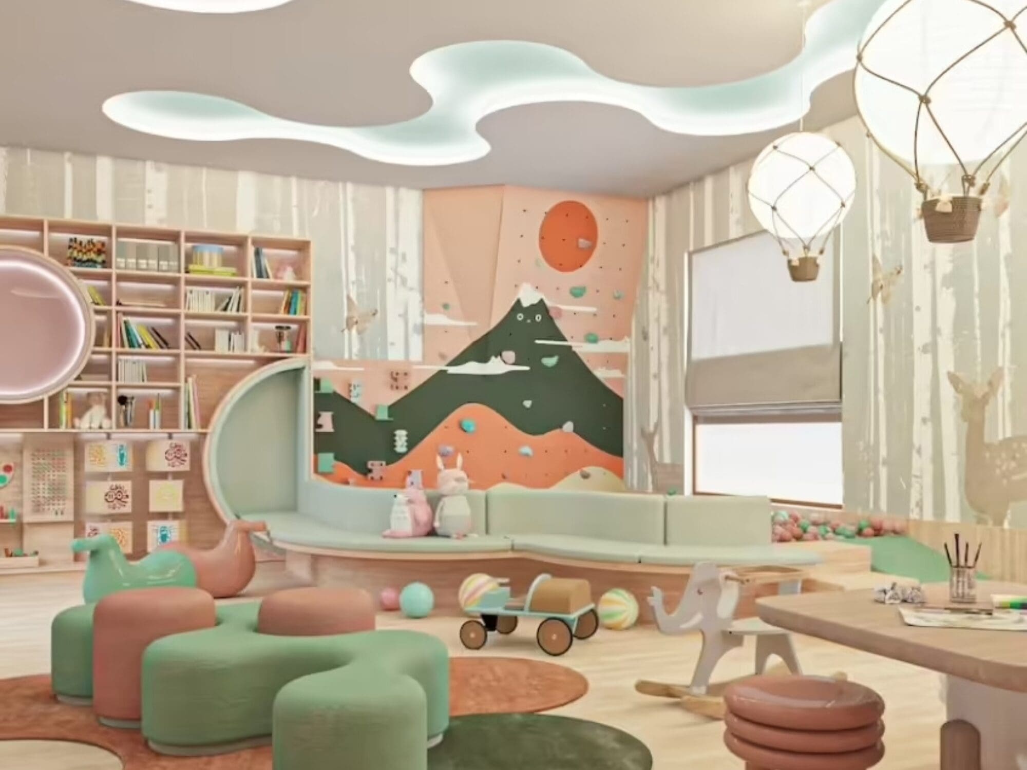 A children's playroom with a whimsical mountain mural, round green seating, a curved bookcase, toys, and a colorful ball pit. Cloud-shaped ceiling lights and hot air balloon chandeliers add charm.
