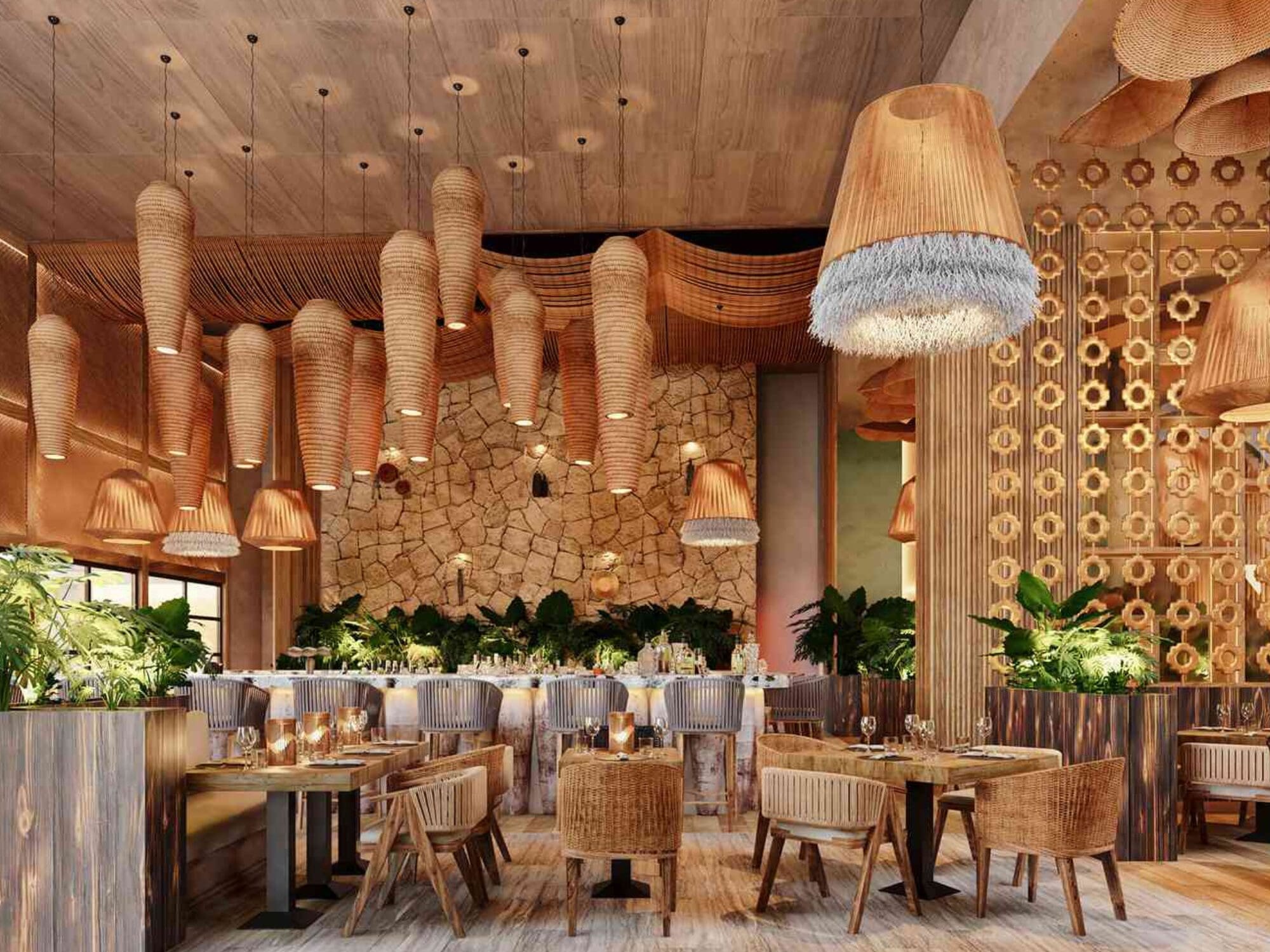 A modern restaurant interior with woven and hanging lamps, wooden furniture, and vibrant green plants. The space features stone-textured walls and a warm, cozy atmosphere with tables set for dining.