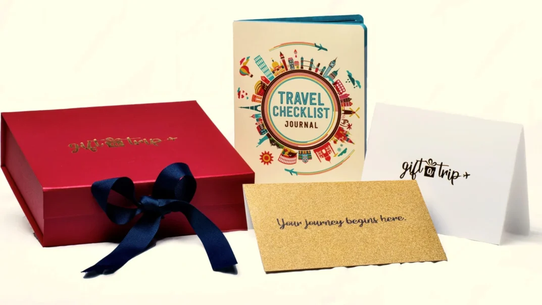 Gift A Trip red gift box with travel certificate, note card and travel journal