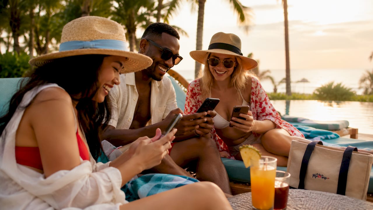 friends enjoying digital gifting at beach pool