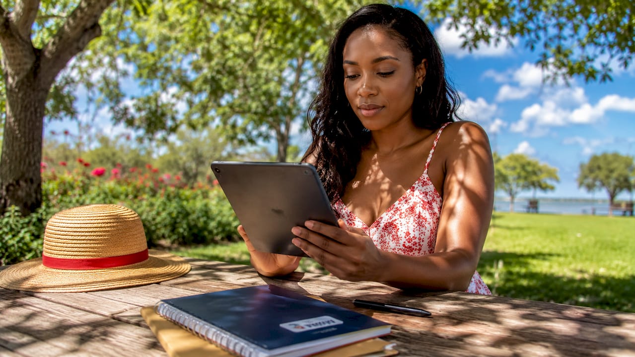 sales incentive ideas list: top 15 for 2026 3 woman reviewing sales data on beach