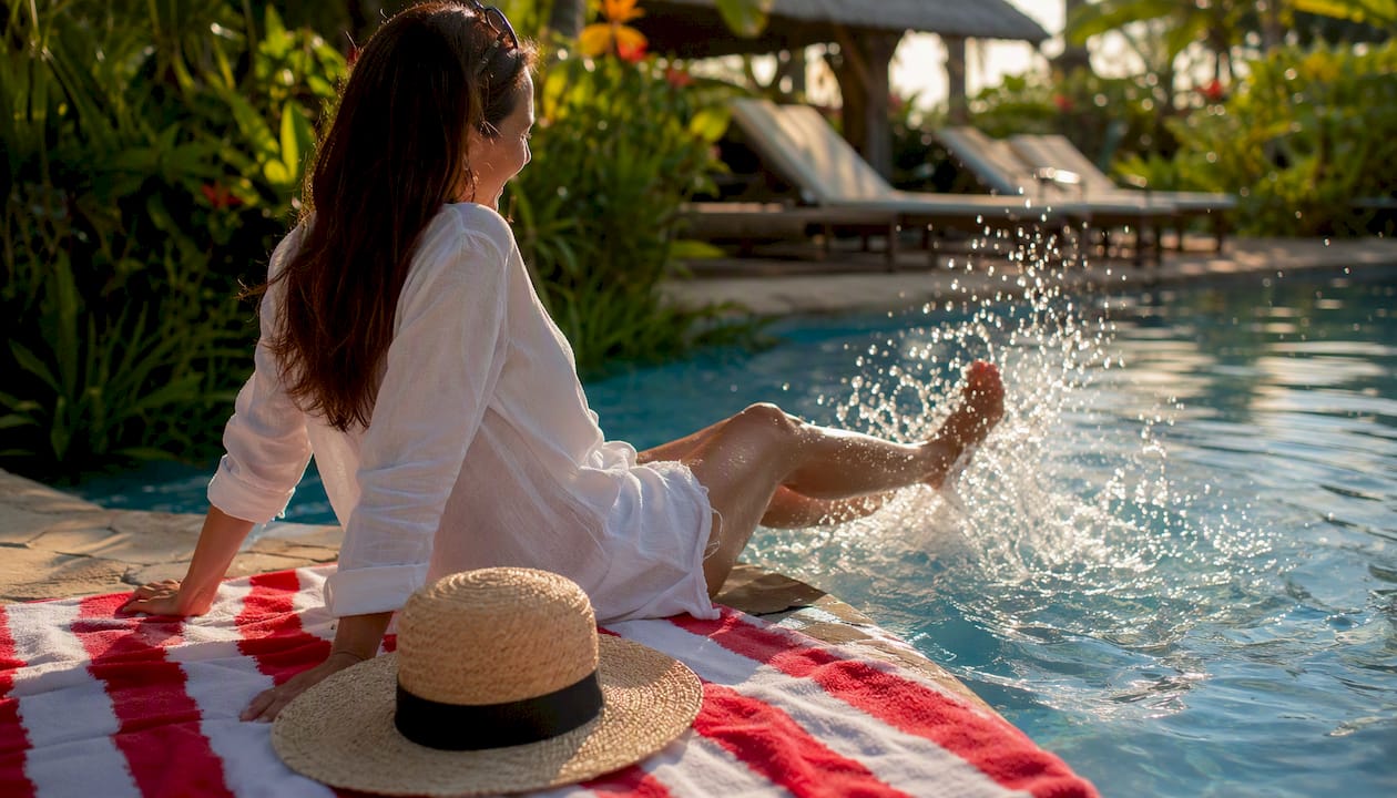 the fastest way to add travel rewards to a referral program 4 traveler dipping feet in tropical pool