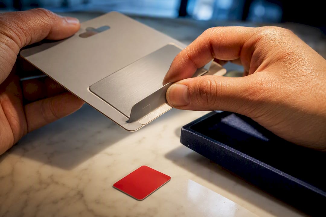 6 rules that stop gift card fraud for consumers and merchants 6 hands inspecting gift card packaging for tampering