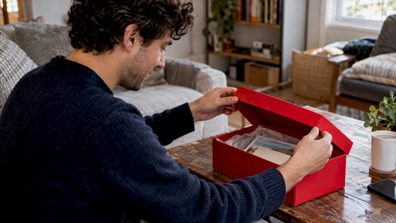 Employee opening a travel gift box